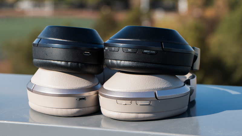 There’s the older MDR-1000X with three buttons on top and the new WH-1000XM2 on bottom with two. You can also see the different ear cup materials with the two models next to each other